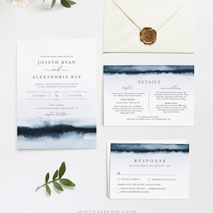 May include: A wedding invitation suite with a blue watercolor design. The invitation card features the names "Joseph Ryan" and "Alexandria Rae" with the date "June 15, 2020" and the time "12 o'clock". The details card includes information about the reception, transportation, and recommended hotels. The response card has a place for guests to RSVP by August 1st and choose their meal option.