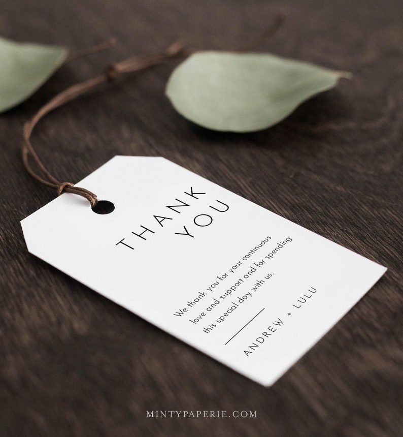 May include: White thank you tag with black text that reads "THANK YOU" and "We thank you for your continuous love and support and for spending this special day with us."  The tag also includes the names "ANDREW + LULU" in black text.
