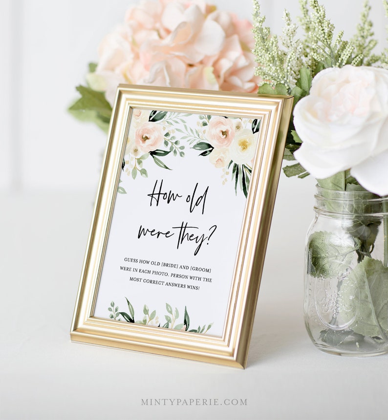 May include: A gold-framed sign with a floral design and the text "How old were they?"  Guess how old the bride and groom were in each photo. Person with the most correct answers wins!