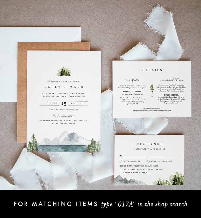 May include: A wedding invitation suite with a watercolor illustration of a mountain lake and forest. The invitation features the names "Emily & Mark" and the date "August 15, 4:30 PM". The RSVP card includes a choice of "Joyfully Accepts" or "Regretfully Declines" and a list of meal options.