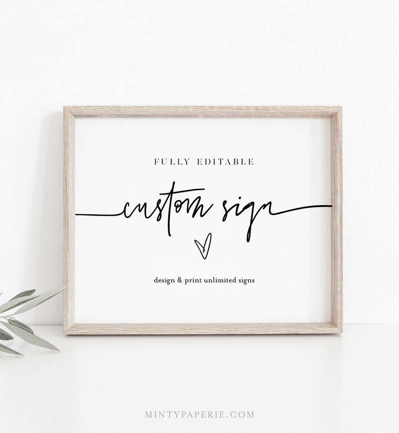 May include: A framed printable sign with the text "FULLY EDITABLE custom sign" and a small heart symbol. The text "design & print unlimited signs" is below the main text. The sign is in a light wood frame and is on a white surface.