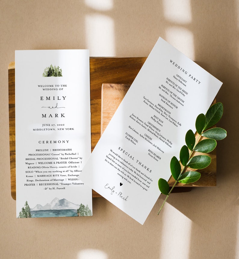 May include: Wedding ceremony program with a watercolor illustration of a forest and lake. The program lists the wedding party, ceremony details, and a special thanks message from the couple, Emily and Mark.