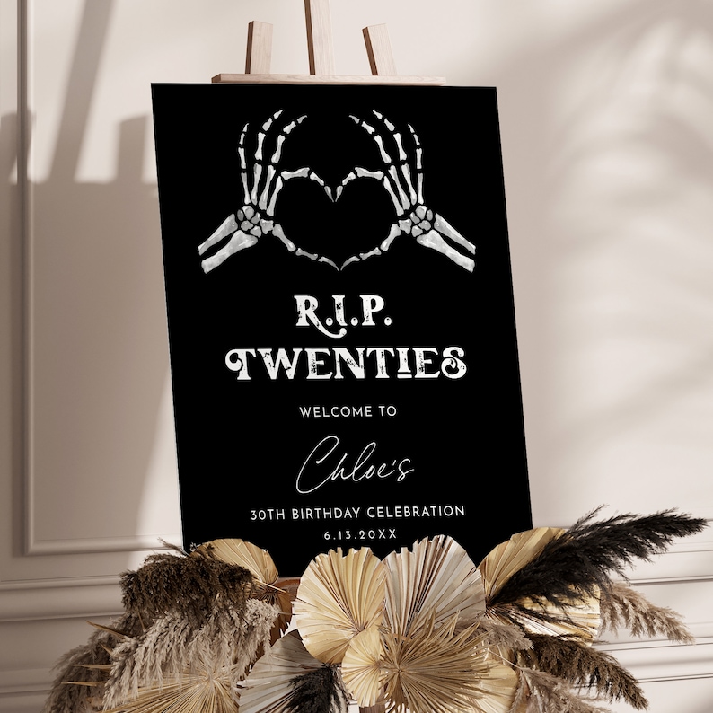 May include: Black and white welcome sign with a skeleton hand heart graphic. The sign reads "R.I.P. TWENTIES" and "Welcome to Chloe's 30th Birthday Celebration 6.13.20XX".