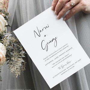 May include: A white wedding invitation with black calligraphy for a wedding ceremony for Naomi and George. The invitation states the date and time of the wedding is Saturday, June 28th, 2020 at 5:30 PM. The location is 501 Willow Boulevard, Middletown, New York. The reception will follow.