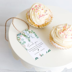 May include: A green and white floral thank you tag with the text "thank you" and "We thank you for your continuous love and support and for spending this special day with us. ELOISE, DAVID".