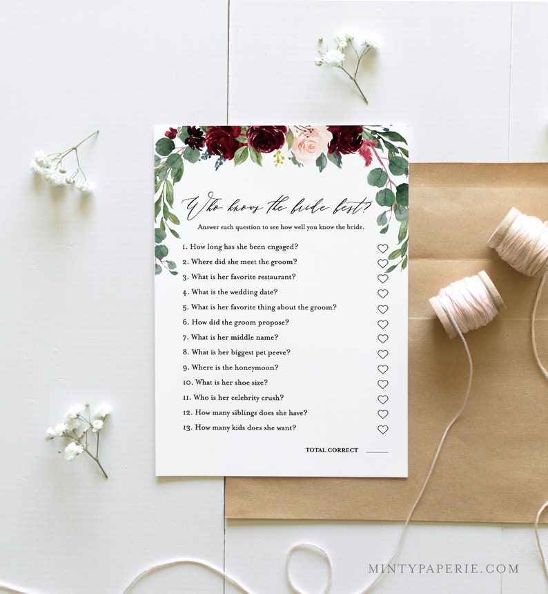 May include: A printable bridal shower game card with a floral design in shades of burgundy and pink. The card features the text "Who knows the bride best?" and includes 13 questions about the bride.