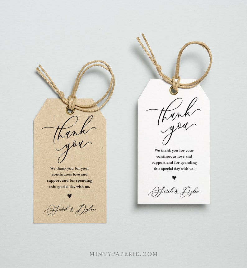 May include: Two wedding favor tags with a brown and white background. The text on the tags reads "Thank you" in a cursive font. The text continues with "We thank you for your continuous love and support and for spending this special day with us." The tags are signed with "Sarah & Dylan".
