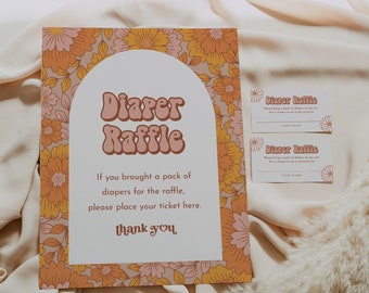 May include: A diaper raffle sign with a retro floral design. The sign says "Diaper Raffle" in a groovy font and includes instructions for guests to place their ticket if they brought a pack of diapers.