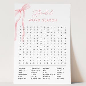 May include: A white bridal word search puzzle with a pink ribbon and the word "Bridal" in elegant script. The puzzle includes words like "Bride," "Groom," and "Wedding." A fun activity for a bridal shower.