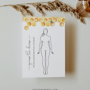 May include: A printable wedding game card with a line drawing of a bride and the text "guess the dress" and "What do you think the bride will wear on her big day?" The card has a watercolor background of honeycomb.