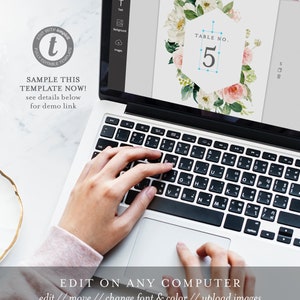 May include: A laptop computer screen displaying a floral wedding table number template with the text "TABLE NO. 5". The template is being edited on the computer using a design program. The text "EDIT ON ANY COMPUTER" is displayed below the laptop.