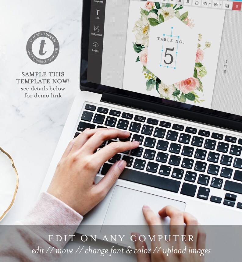 May include: A laptop computer screen displaying a floral wedding table number template with the text "TABLE NO. 5". The template is being edited on the computer using a design program. The text "EDIT ON ANY COMPUTER" is displayed below the laptop.