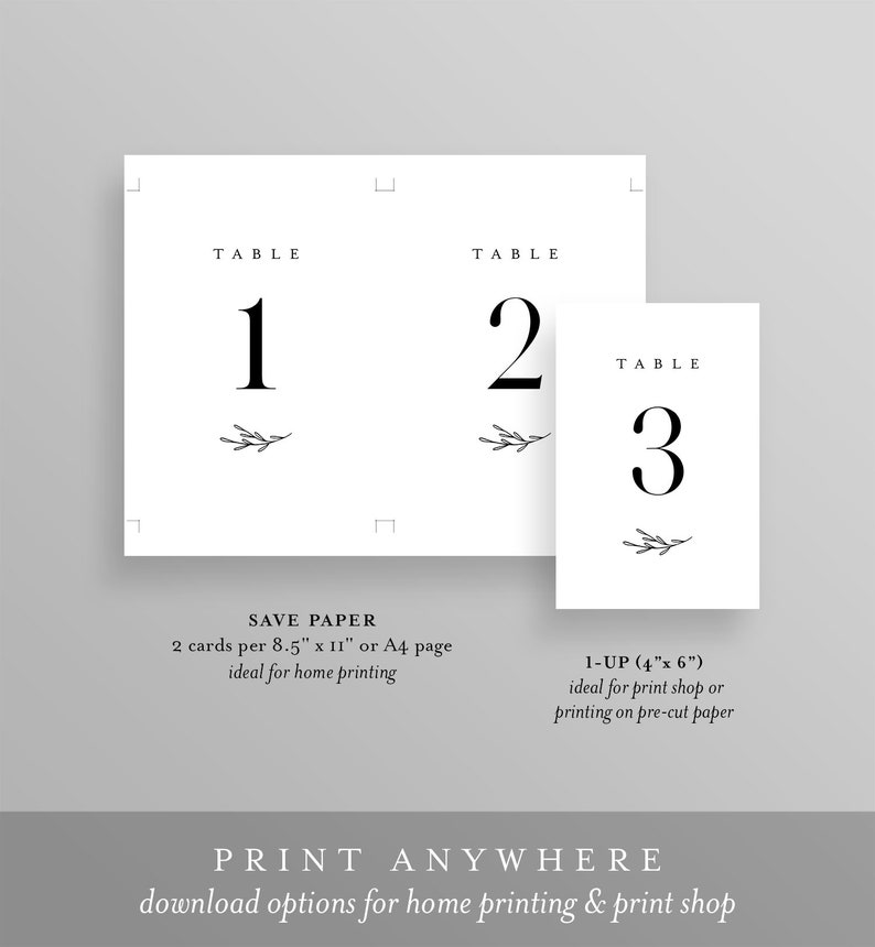May include: Printable table number cards with a simple, minimalist design. The cards feature a black number with a small sprig of greenery. The text "TABLE" is printed above the number. The cards are designed to be printed on 8.5 x 11 inch paper or A4 paper. The text "SAVE PAPER" is printed below the cards. The text "1-UP (4" x 6")" is printed below the cards. The text "PRINT ANYWHERE" is printed below the cards. The text "download options for home printing & print shop" is printed below the cards.
