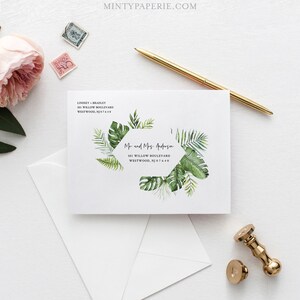May include: A white envelope with a green tropical leaf design and a return address label that reads "Lindsey Bradley, 501 Willow Boulevard, Westwood, NJ 07640". The envelope also has a sticker with a green tropical leaf design and the text "Mr and Mrs. Anderson, 501 Willow Boulevard, Westwood, NJ 07640".