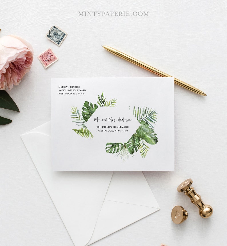 May include: A white envelope with a green tropical leaf design and a return address label that reads "Lindsey Bradley, 501 Willow Boulevard, Westwood, NJ 07640". The envelope also has a sticker with a green tropical leaf design and the text "Mr and Mrs. Anderson, 501 Willow Boulevard, Westwood, NJ 07640".