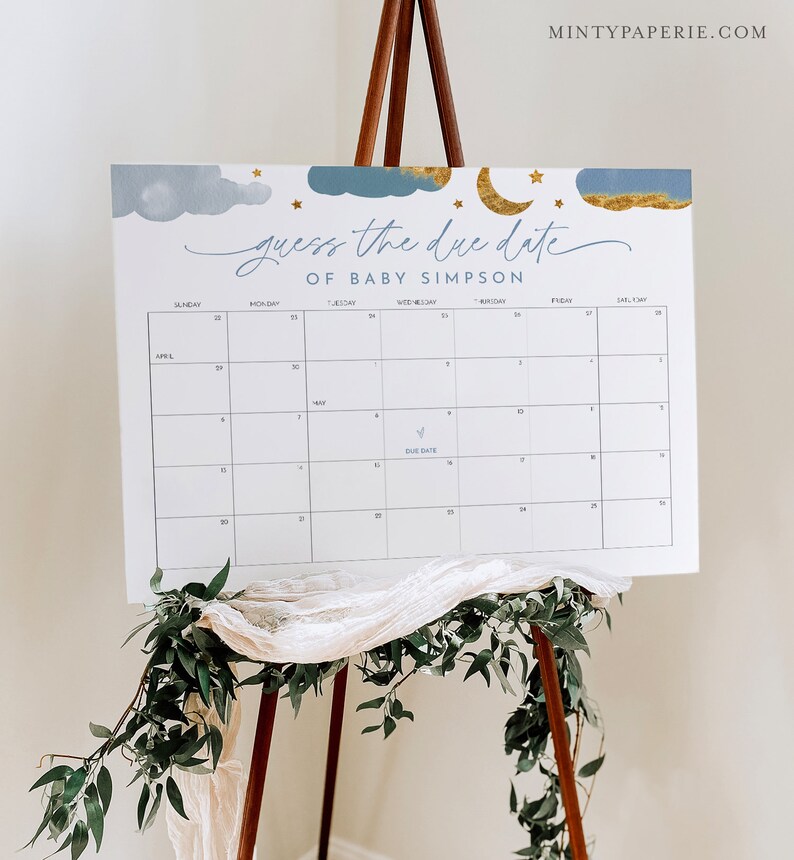May include: A blue and gold baby shower game with a calendar to guess the due date of Baby Simpson. The calendar has a blue star marking the due date.