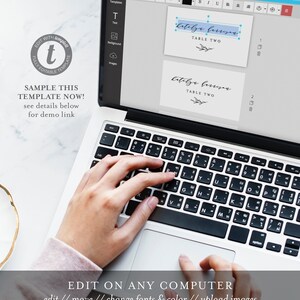 May include: A laptop computer screen displaying a template for a table card with the text "Katelja Bernsen, Table Two". The screen shows a hand typing on the keyboard. The text "Edit on any computer, edit // move // change fonts & color // upload images" is displayed below the laptop.