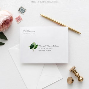 以下が含まれることがあります： 緑の葉のデザインが施された白い封筒で、"Mr. and Mrs. Anderson 501 Willow Boulevard Westwood, NJ 07890"というテキストが印刷されています。