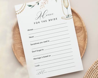 May include: A printable bridal shower game card with the text "Advice for the Bride". The card has a floral design with a champagne glass and pearls.