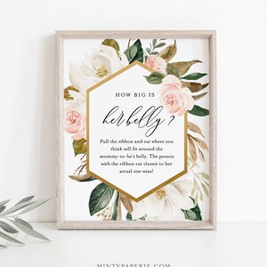 May include: A white and gold printable baby shower game card with pink and green floral illustrations. The text reads "How big is her belly?" and includes instructions for a game where guests guess the size of the mother-to-be's belly.