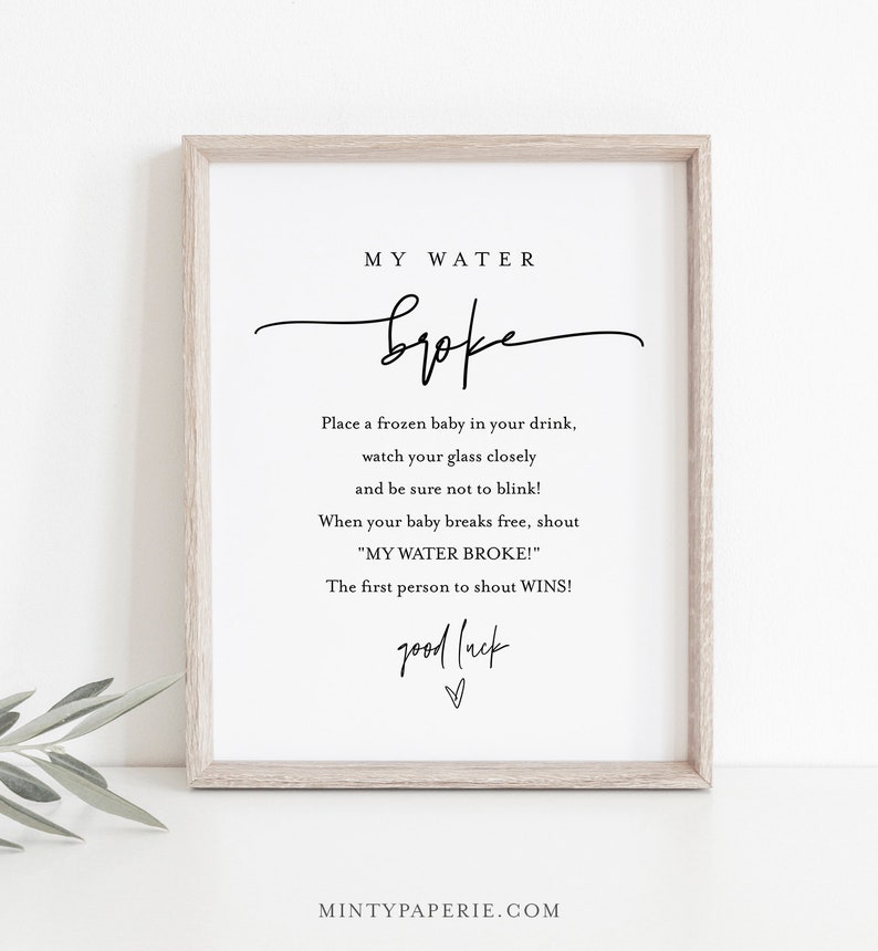 May include: Printable sign with the text "MY WATER broke" and instructions for a game where guests place a frozen baby in their drink and shout "MY WATER BROKE!" when it melts. The first person to shout wins. The sign also says "good luck".