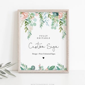 May include: A framed custom sign with a watercolor floral design. The sign features the text "Custom Sign" in elegant script, with additional text indicating it is fully editable. The floral elements include pink roses and green foliage.