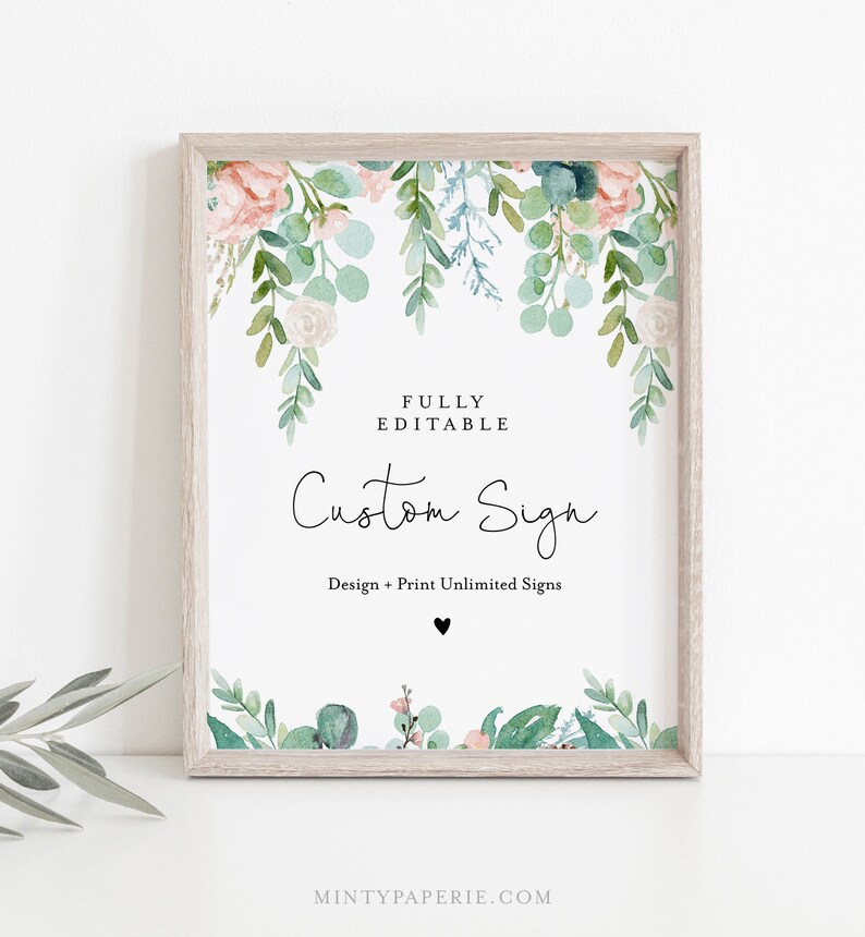 May include: A framed custom sign with a watercolor floral design. The sign features the text "Custom Sign" in elegant script, with additional text indicating it is fully editable. The floral elements include pink roses and green foliage.