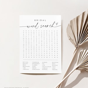 May include: A printable bridal word search puzzle with a white background and black text. The puzzle features words related to weddings, such as "reception", "bride", "groom", and "wedding".