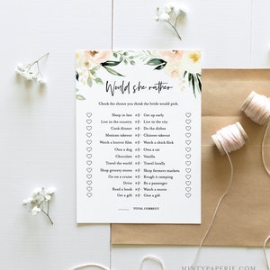 May include: A printable bridal shower game with a floral design. The game asks guests to guess which of two choices the bride would prefer. The game includes questions like "Sleep in late or Get up early?" and "Own a dog or Own a cat?"