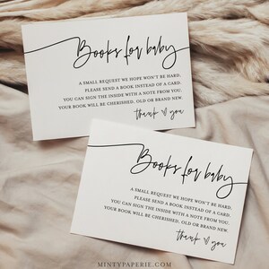 May include: Two white cards with black text that reads "Books for baby". The text on the cards requests guests to bring a book instead of a card for the baby. The cards also include the text "thank you".