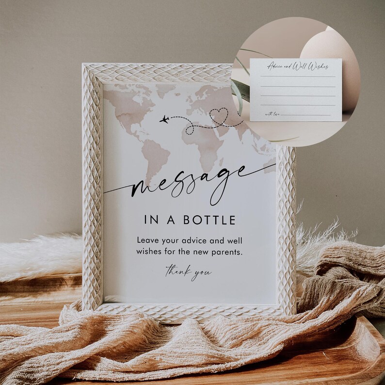 May include: White frame with a world map and the text "message in a bottle" with instructions to leave advice and well wishes for the new parents. A small card with the text "Advice and Well Wishes" is also included.