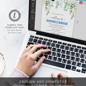 May include: A laptop computer displaying a wedding invitation template with a watercolor floral design. The invitation text reads "You're invited to the wedding of Eloise + David" with a blue and white accent. The text also includes the date, time, and location of the wedding. The laptop keyboard is visible with a hand typing on it.