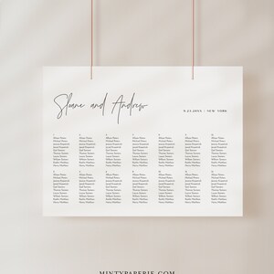 May include: A wedding seating chart with the names Sloane and Andrew at the top, followed by the date 9.23.20XX and the location New York. The chart lists 14 tables with guest names on each table.