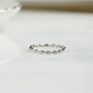Closeup image of dainty 925 sterling silver stacking ring