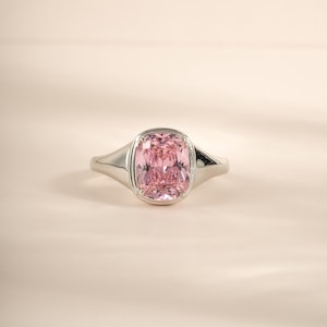Elongated cz diamond solitaire ring in sterling silver with a pink stone