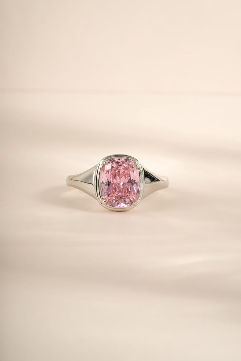 Elongated cz diamond solitaire ring in sterling silver with a pink stone