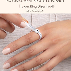 May include: A white ring sizer tool is wrapped around a finger, with measurements visible. The text "NOT SURE WHAT RING SIZE TO GET? Try our Ring Sizer Tool! Link in Description!" is displayed above the hand. The Sami Jewels logo is in the top left corner.