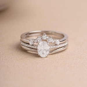 Sterling silver stackable ring set on a beige background