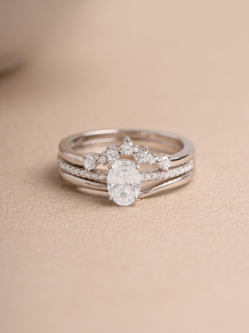 Sterling silver stackable ring set on a beige background