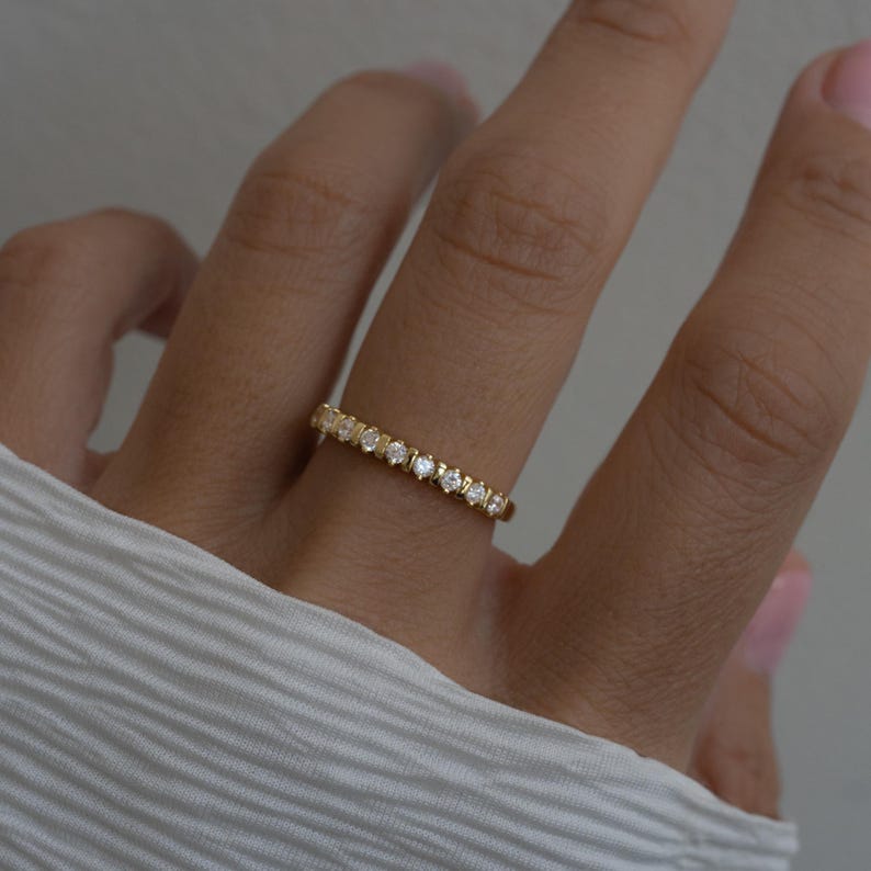 model wearing dainty gold cz fluted stacking ring