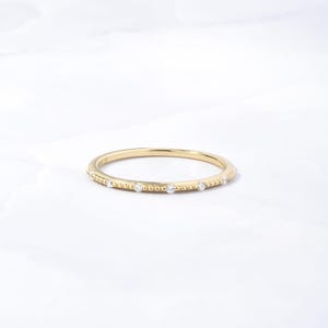 Minimalist gold ring with cubic zirconia stones