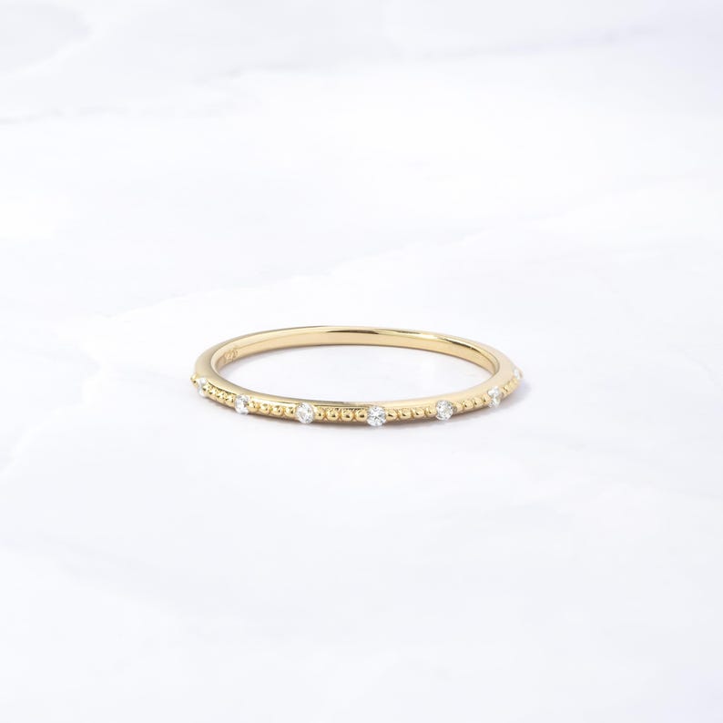 Minimalist gold ring with cubic zirconia stones