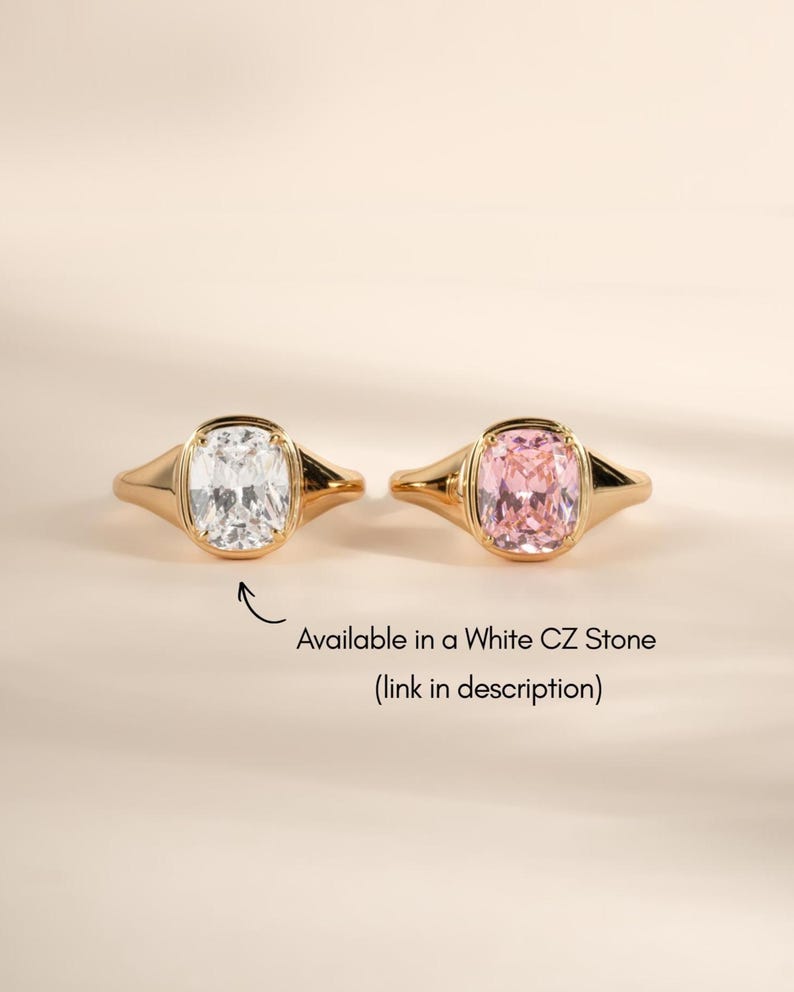 Elongated cushion cut gemstone rings shown in the pink stone colorway alongside the white CZ stone option.