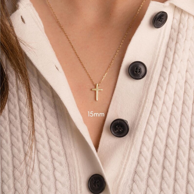 Model wearing minimalist cross necklace