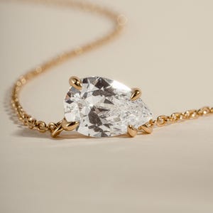Gold diamond pendant on a gold chain