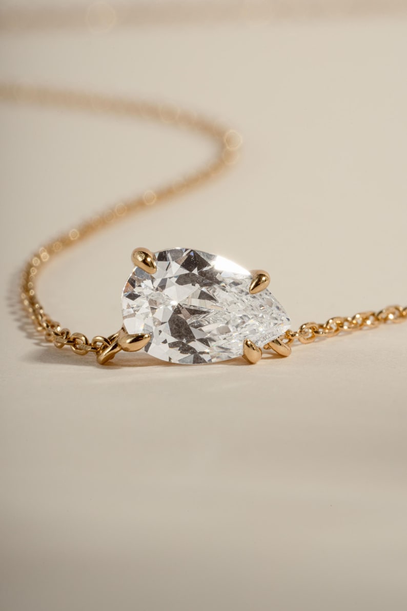Gold diamond pendant on a gold chain