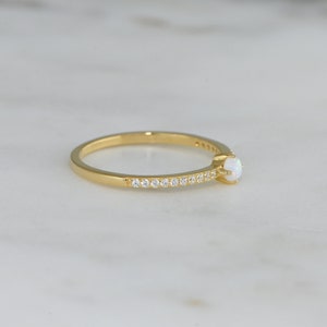 side view of gold opal minimalist ring
