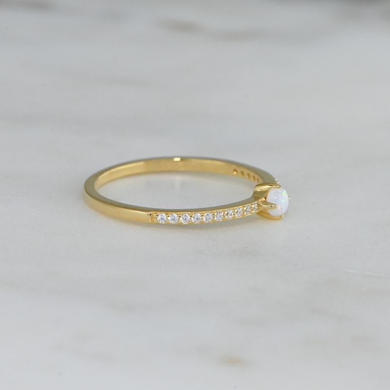 side view of gold opal minimalist ring