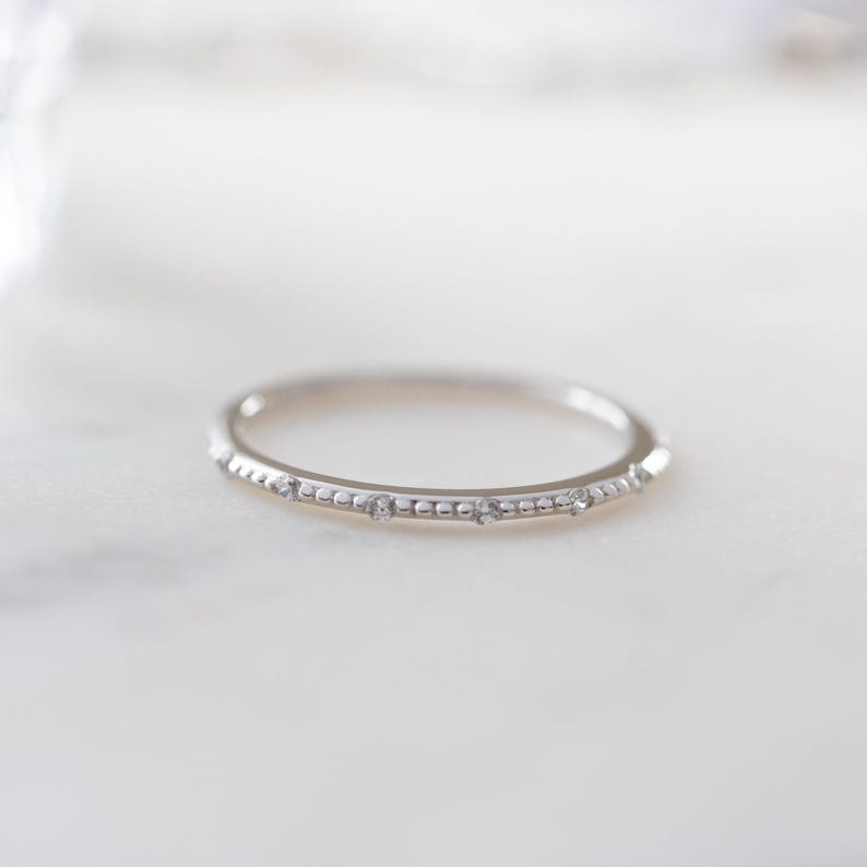 Thin silver ring with diamonds