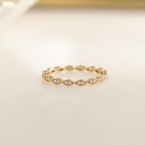 Closeup image of dainty stacking ring in gold